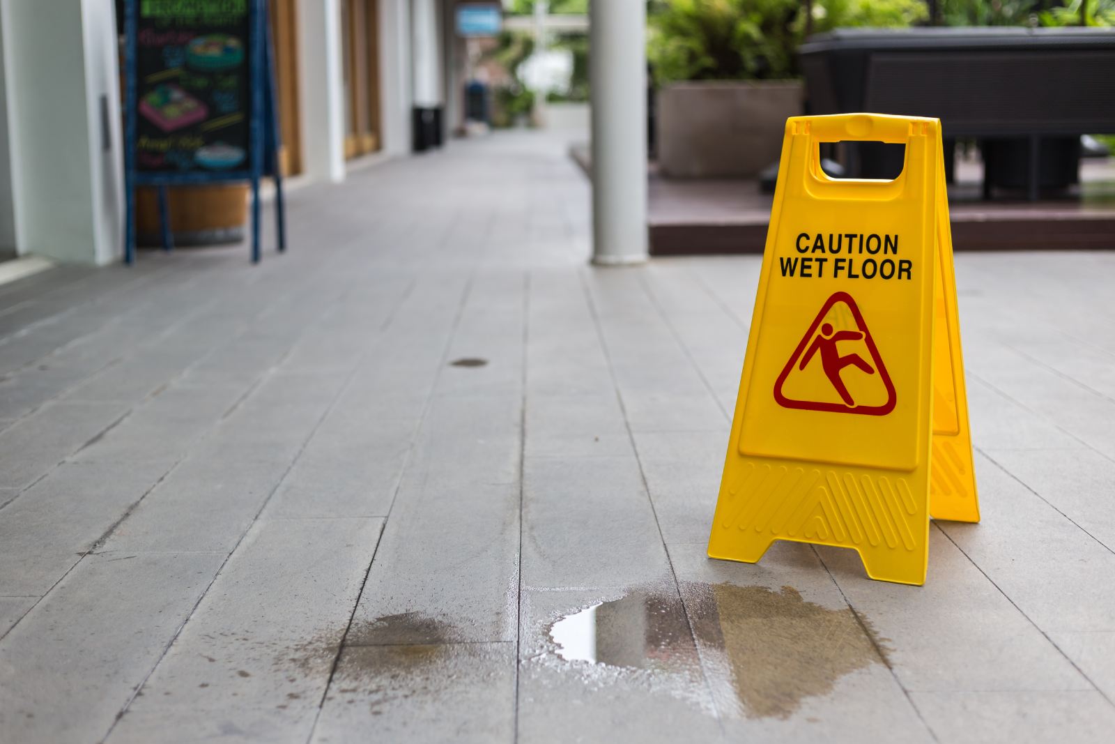 Caution Wet Floor sign on a wet floor