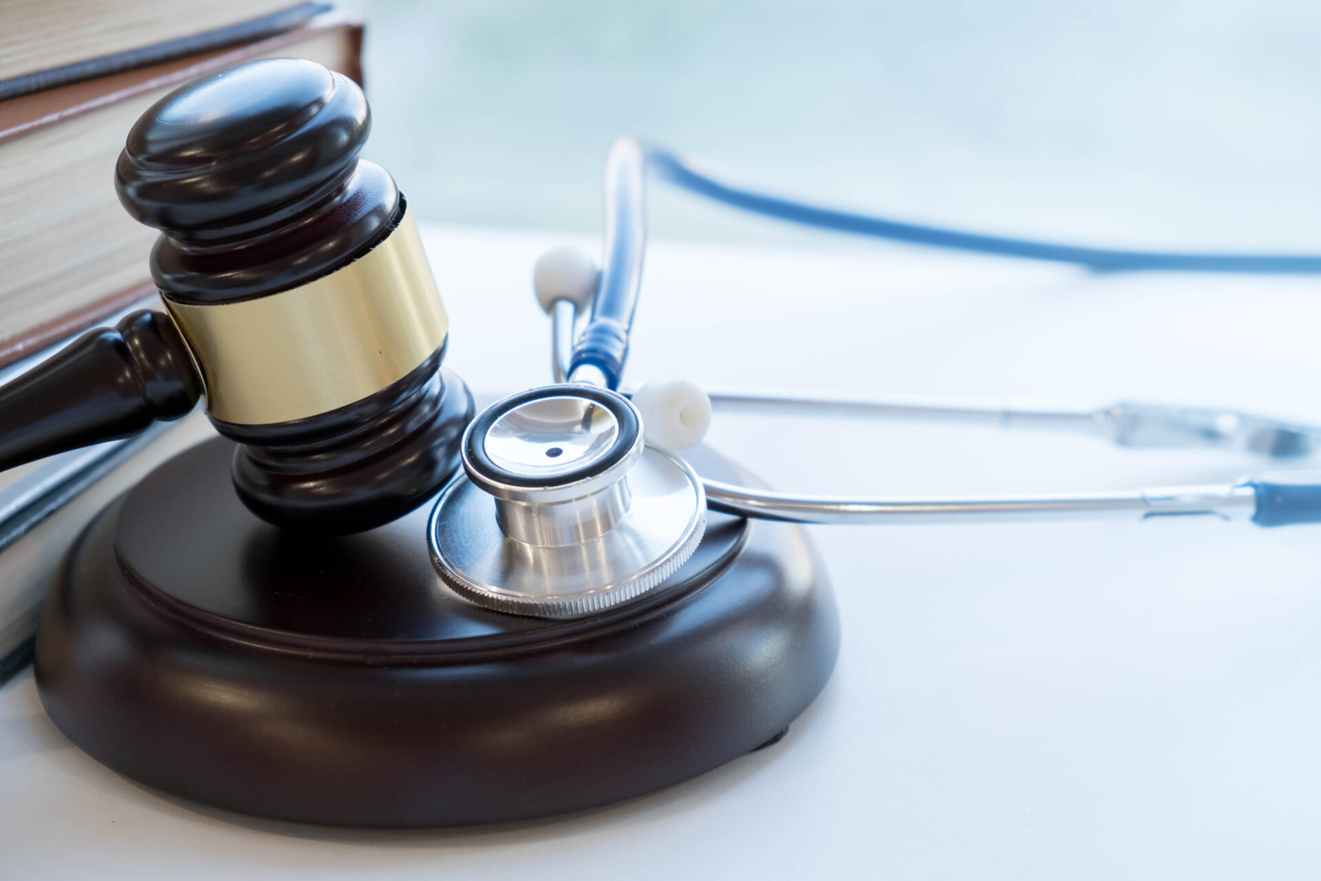 Gavel and stethoscope. medical jurisprudence. legal definition of medical malpractice. attorney. common errors doctors, nurses and hospitals make.