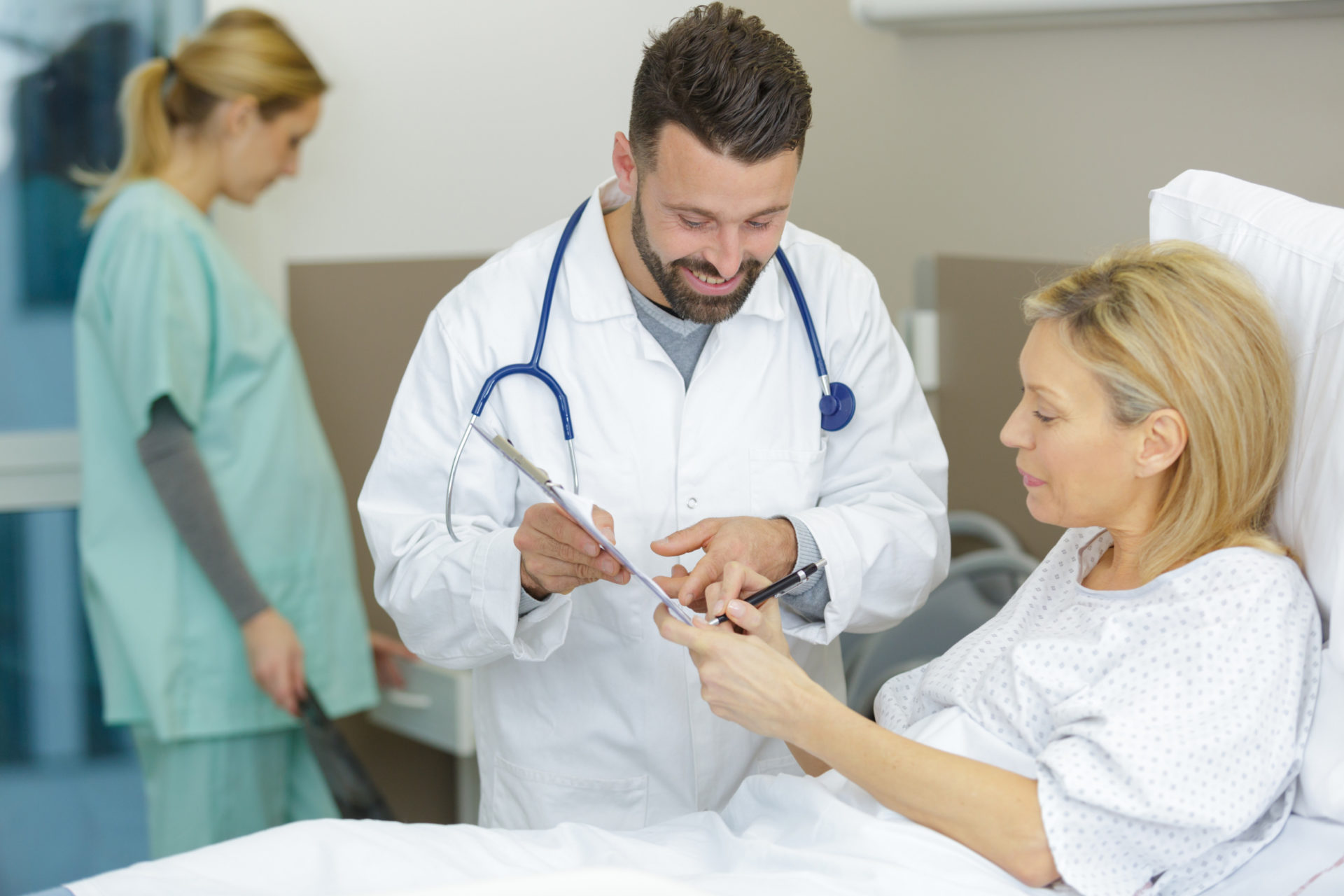 doctor with patient reading a document