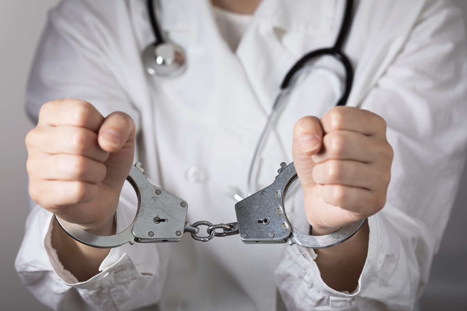 Doctor in handcuffs