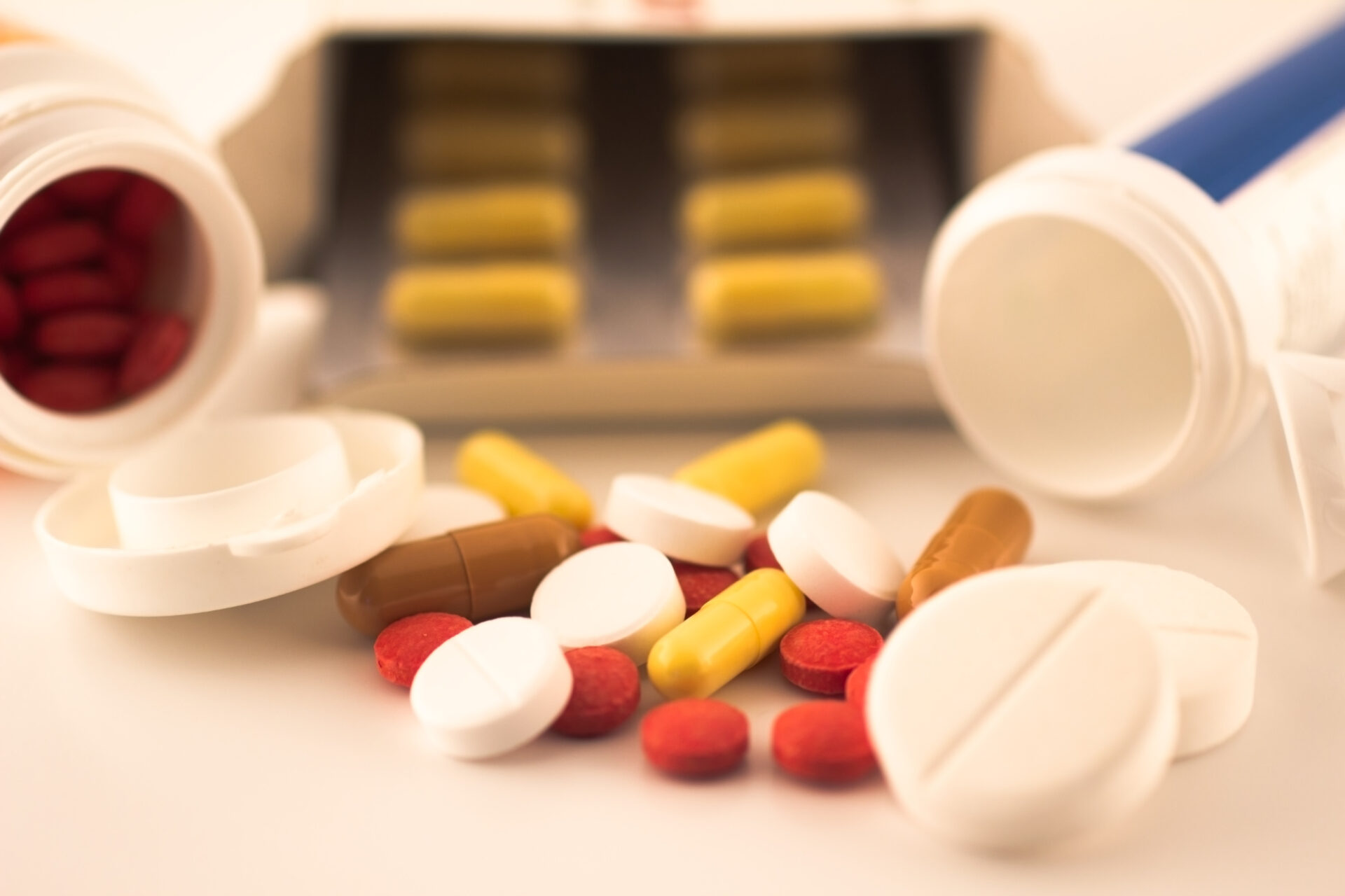 Prescription errors - several prescription bottles and pills on a table - The Pagan Law Firm