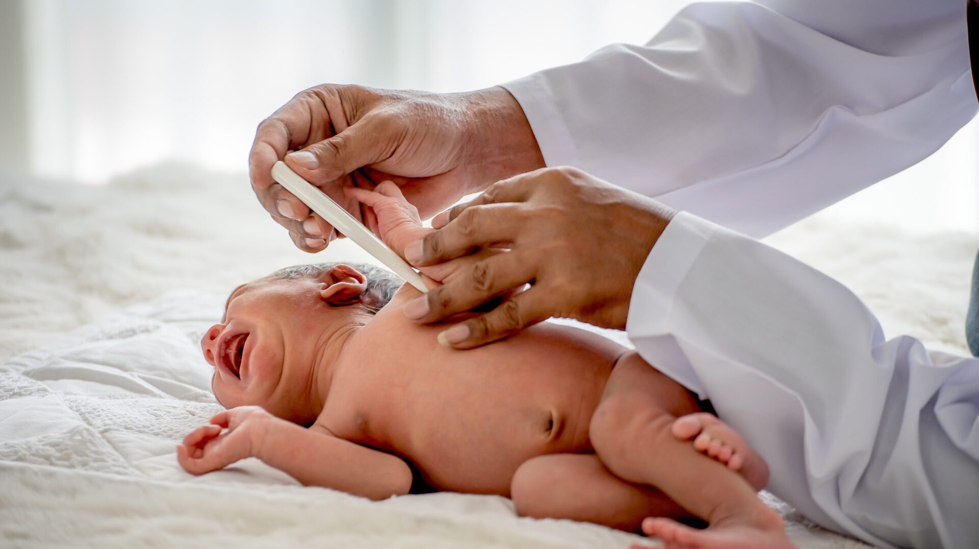 Newborn Seizures Lawyer - Newborn been checked by a doctor - The Pagan Law Firm